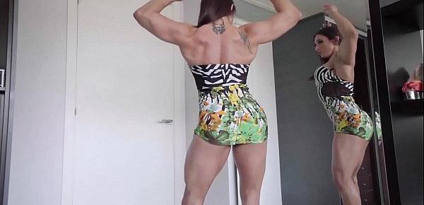  Karyn Bayres is a super-stacked Argentinean powerhouse of muscular womanhood.This busty and athletic MILF flexes her sculpted body in front of a mirror and gets excited.